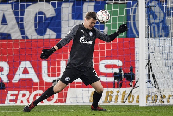 Schalke goalkeeper Alexander Nuebel saves a ball during the German soccer cup, DFB Pokal, quarterfinal match between FC Schalke 04 and Werder Bremen in Gelsenkirchen, Germany, Wednesday, April 3, 2019 ...