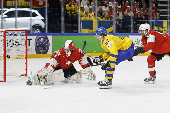 Sweden&#039;s forward Rickard Rakell #67 missing a goal against Switzerland&#039;s goaltender Leonardo Genoni, left, past defender Roman Josi, right, during the IIHF 2018 World Championship preliminar ...