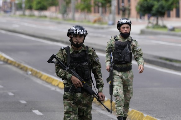 Soldiers patrol the streets during legislative elections in Bogota, Colombia, Sunday, March 13, 2022. Colombians went to the polls to renew Congress, and also to choose presidential candidates from th ...