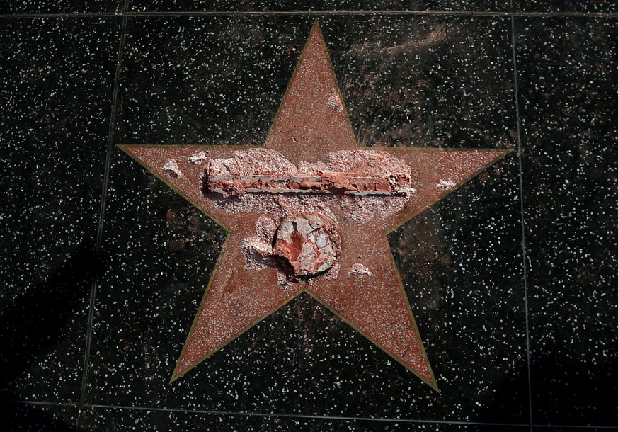 Donald Trump&#039;s star on the Hollywood Walk of Fame is seen after it was vandalized in Hollywood, California U.S., October 26, 2016. REUTERS/Mario Anzuoni