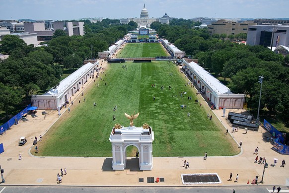 People attend the Great American State Fair, as seen from the top of the ferris wheel, on the National Mall, Wednesday, July 1, 2026, in Washington. (AP Photo/Jacquelyn Martin)
APTOPIX America 250