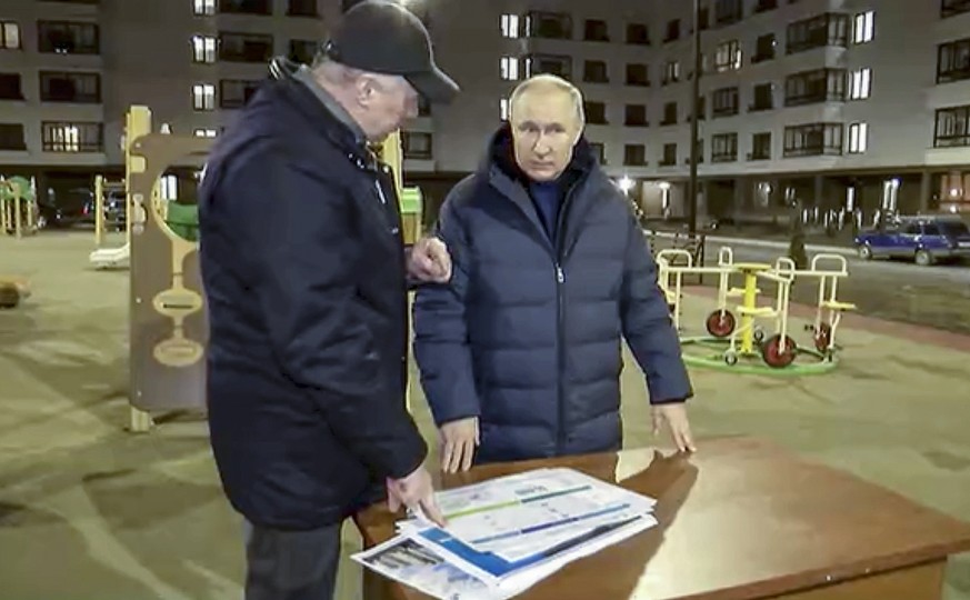 epa10532127 A still image taken from a handout video provided by the Russian President&#039;s press service on 19 March 2023 shows Russian President Vladimir Putin (R) and Deputy Prime Minister Marat  ...