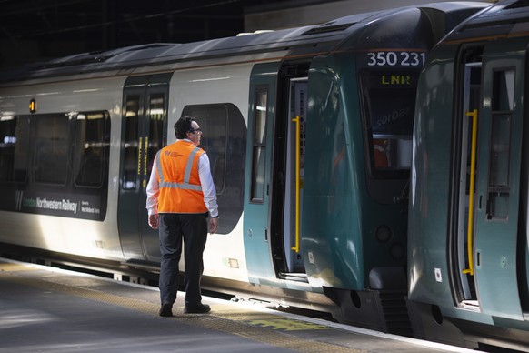 epa10669339 A platform staff works at Euston Station as the RMT union members begin their two day strike action as part of a long-running dispute with train operators over jobs, pay and conditions, in ...