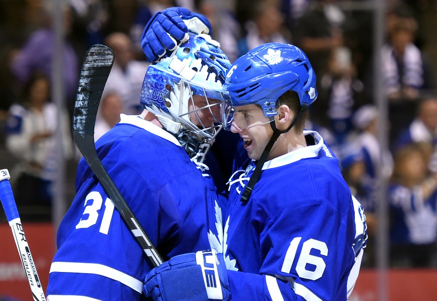 Oct 15, 2016; Toronto, Ontario, CAN; Toronto Maple Leafs forward Mitch Marner (16) embraces goalie Frederik Andersen (31) as they celebrate a 4-1 win over Boston Bruins at Air Canada Centre. Mandatory ...