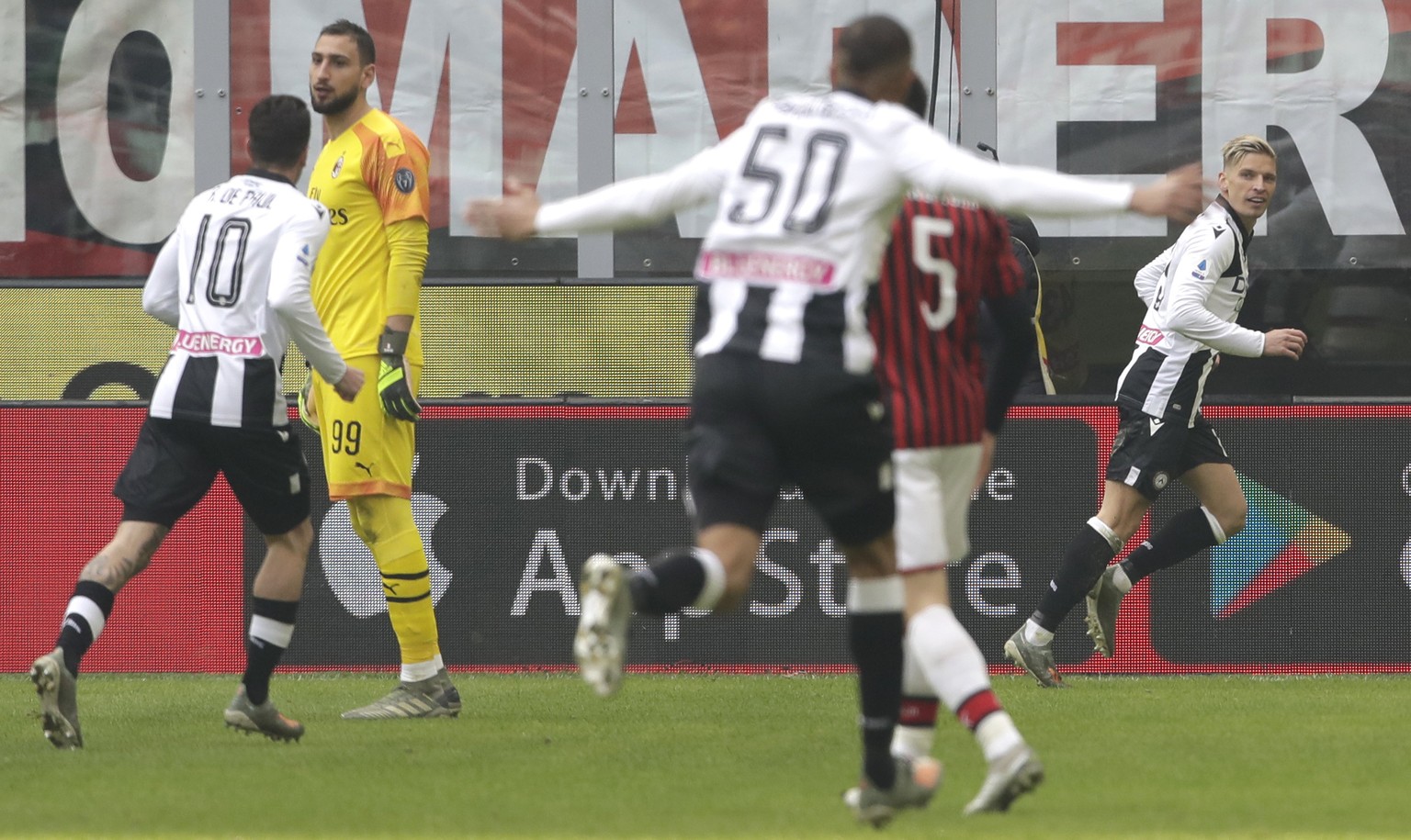 Udinese&#039;s Jens Stryger Larsen celebrates after scoring his side&#039;s opening goal during a Serie A soccer match between AC Milan and Udinese, at the San Siro stadium in Milan, Italy, Sunday, Ja ...