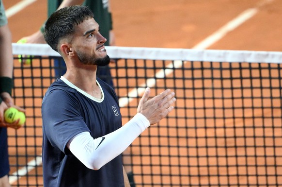 epa12942380 Dino Prizmic of Croatia greets attendees after winning against Novak Djokovic of Serbia during their Men's Singles round of 64 match at the Italian Open tennis tournament in Rome, Ita ...