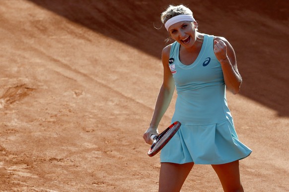 Timea Bacsinszky of Switzerland celebrates after winning her second round match against Mandy Minella of Luxembourg, at the WTA Ladies Championship tennis tournament in Gstaad, Switzerland, Friday, Ju ...