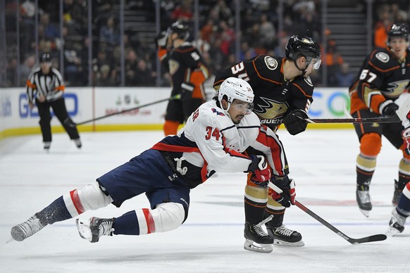 Washington Capitals defenseman Jonas Siegenthaler, left, and Anaheim Ducks center Sam Steel compete for the puck during the second period of an NHL hockey game Friday, Dec. 6, 2019, in Anaheim, Calif. ...