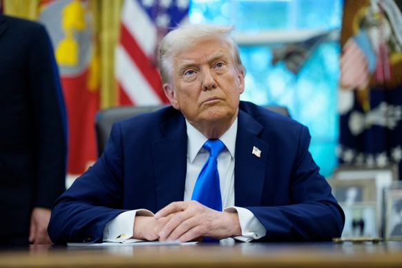 epa12391168 United States President Donald J Trump looks on to the media during an Executive Order signing which authorizes the new Trump Gold Card, a visa program to be overseen by the Secretary of C ...
