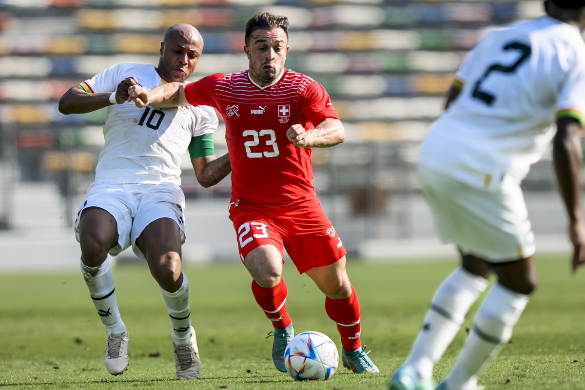 epa10309999 Ghana's forward Andre Ayew (L) in action against Switzerland's midfielder Xherdan Shaqiri during a friendly soccer match between Ghana and Switzerland ahead of the upcoming FIFA  ...
