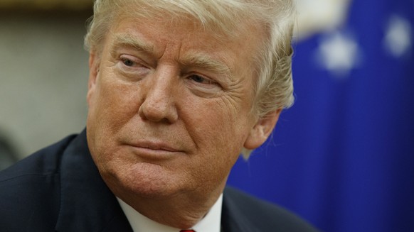 FILE - In this Jan. 10, 2018, file photo, President Donald Trump listens during a meeting in the Oval Office of the White House, in Washington. Casting a cloud over already tenuous negotiations, Presi ...