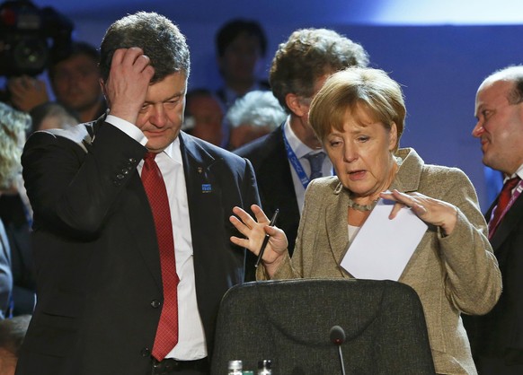 Poroschenko und Merkel am Nato-Gipfel.