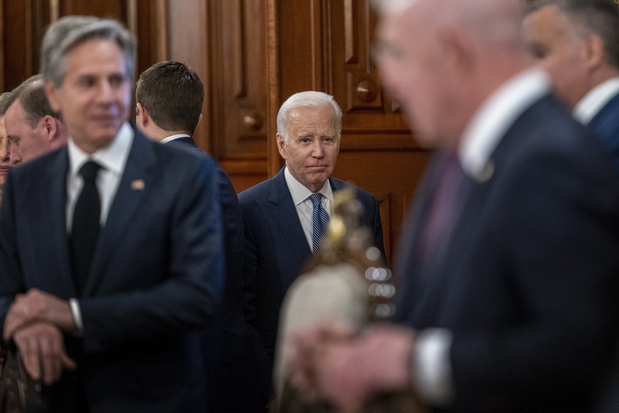 President Joe Biden, center, accompanied by Secretary of State Antony Blinken, left, arrives for a meeting with Mexican President Andres Manuel Lopez Obrador at the National Palace in Mexico City, Mex ...