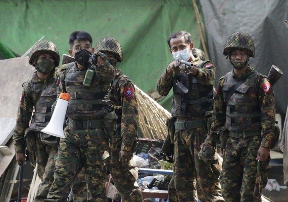 epa09047940 Soldiers advance to disperse protesters during a protest against the military coup in Yangon, Myanmar, 03 March 2021. Foreign ministers of the Association of Southeast Asian Nations (ASEAN ...