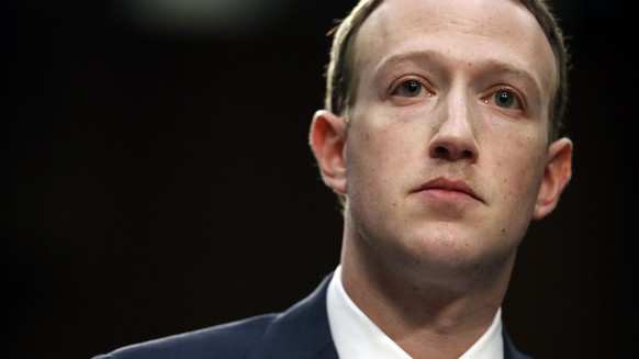 FILE- In this April 10, 2018, file photo, Facebook CEO Mark Zuckerberg testifies before a joint hearing of the Commerce and Judiciary Committees on Capitol Hill in Washington. Last spring, as false cl ...