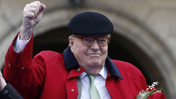 FILE - In this May 1 2017 file photo, former far-right National Front party leader Jean-Marie Le Pen clenches his fist at the statue of Joan of Arc, in Paris. A French appeals court has upheld Friday  ...