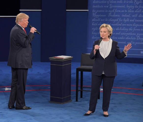 TV Duell Clinton - Trump Democratic presidential candidate Hillary Clinton (R) and Republican presidential candidate Donald Trump speak in their presidential debate at Washington University in St. Lou ...