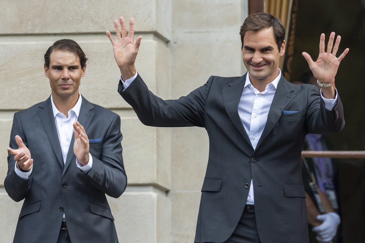 Team Europe's Rafael Nadal, left, and Roger Federer, right, greet the fans, during the official welcome ceremony together with other tennis players ahead of the Laver Cup in Geneva, Switzerland,  ...