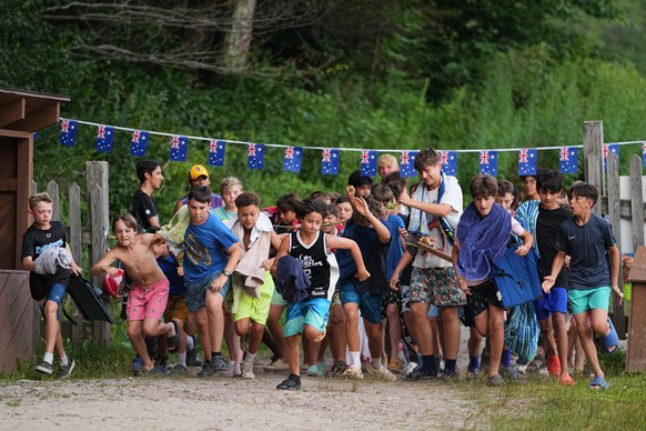 Campers run to the waterfront for an evening swim at the Frost Valley YMCA sleepaway camp in Claryville, N.Y., Wednesday, July 30, 2025. The camp partnered with Children&#039;s Hospital at Montefiore  ...