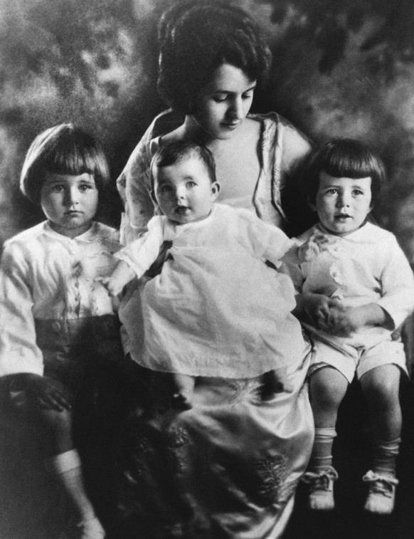 Rose Kennedy sits with three of her young children: Joseph, Jr., Rosemary, and Jack.