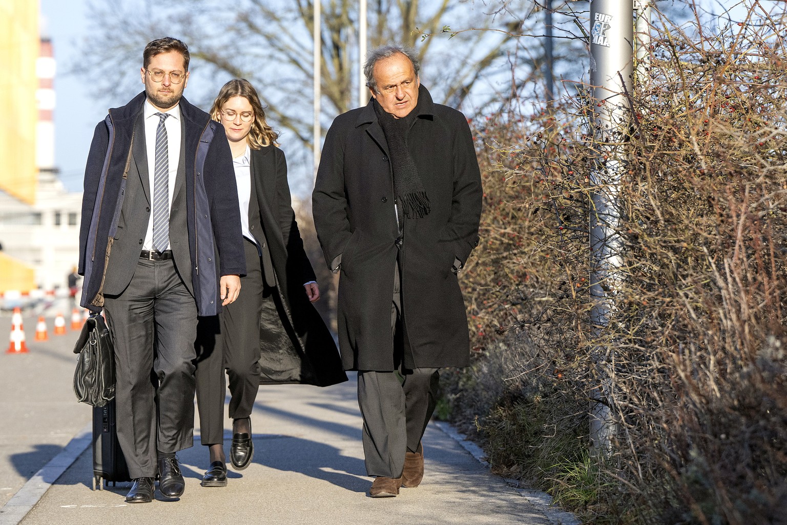 epa11937339 Former UEFA president Michel Platini (R) and his lawyer Dominic Nellen (L) arrive at the Special appeals court, in Muttenz, near Basel, Switzerland, 03 March 2025. The court will hear Swit ...