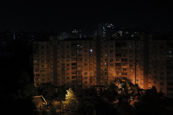 epa10259373 A part of the city in darkness during cyclic power cutoffs to reduce the power grid load in residential area in Kyiv (Kiev), Ukraine, 22 October 2022. Russian troops on 24 February entered ...