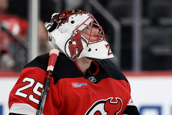 New Jersey Devils goaltender Jacob Markstrom reacts after giving up a goal during the third period of an NHL hockey game against the Vegas Golden Knights, Friday, Dec. 5, 2025, in Newark, N.J. (AP Pho ...