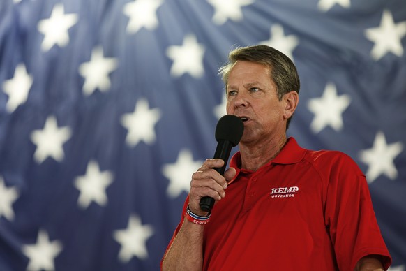 FILE - Georgia Gov. Brian Kemp speaks during the 17th annual Floyd County GOP Rally at the Coosa Valley Fairgrounds on Saturday, Aug. 7, 2021 in Rome, Ga. Kemp issued an executive order Thursday, Aug. ...