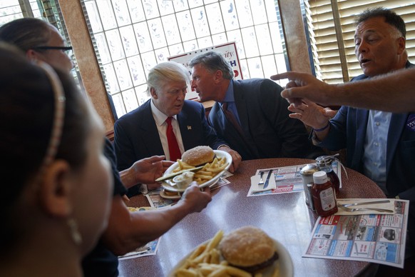 FILE - In this Sept. 12, 2016, file photo, then-Republican presidential candidate Donald Trump sits down for lunch during a visit to the Boulevard Diner in Dundalk, Md. President Donald Trump is getti ...