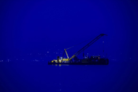 FILE -The multi-purpose floating work barge Hebo Lift 2 monitors the stretch of sea off Porticello, near Palermo, Sicily, Italy, May 4, 2025, where the British superyacht Bayesian sunk on August 19, 2 ...