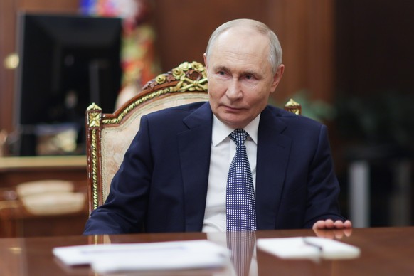 epa11834470 Russian President Vladimir Putin looks on during his meeting with the President of the National Medical Research Centre for Endocrinology Ivan Dedov(not pictured) in Moscow, Russia, 18 Jan ...