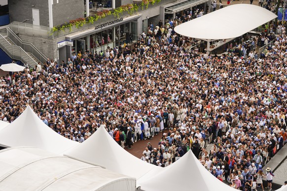 Tennis fans line up to get into Arthur Ashe Stadium to watch Jannik Sinner, of Italy, and Carlos Alcaraz, of Spain, play in the men&#039;s singles final of the U.S. Open tennis championships, Sunday,  ...