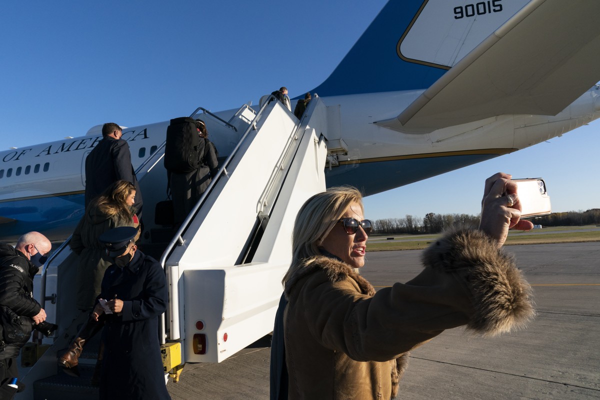 Fox News Laura Ingraham takes a picture before boarding Air Force One to accompany President Donald Trump, at Green Bay Austin Straubel International Airport, Friday, Oct. 30, 2020, in Green Bay, Wis. ...