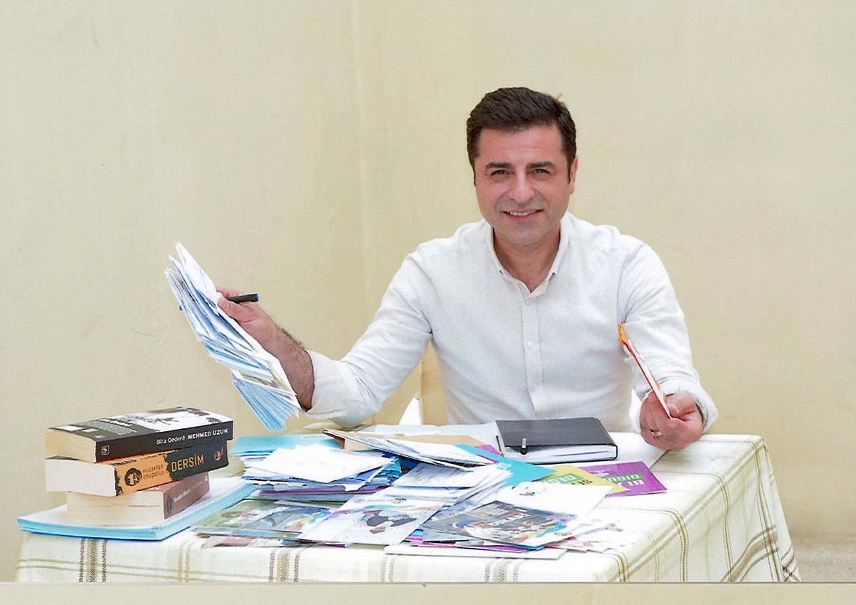 In this undated file handout photo, made available on Friday, June 8, 2018 by the pro-Kurdish Peoples' Democratic Party, (HDP) former co-leader Selahattin Demirtas, poses for a photo, in prison i ...