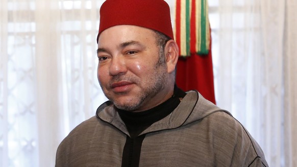 Morocco&#039;s King Mohammed VI, right and Rwanda&#039;s President Paul Kagame, left pose for photographers after he was awarded the order of Ouissam Alaouite by King Mohammed VI of Morocco during a c ...