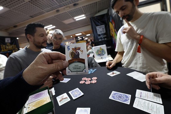 epa12781722 Visitors play RatJack game at the Studio H Company stand during the Cannes International Games Festival 2026, in Cannes, France, 27 February 2026. The Cannes International Games Festival ...
