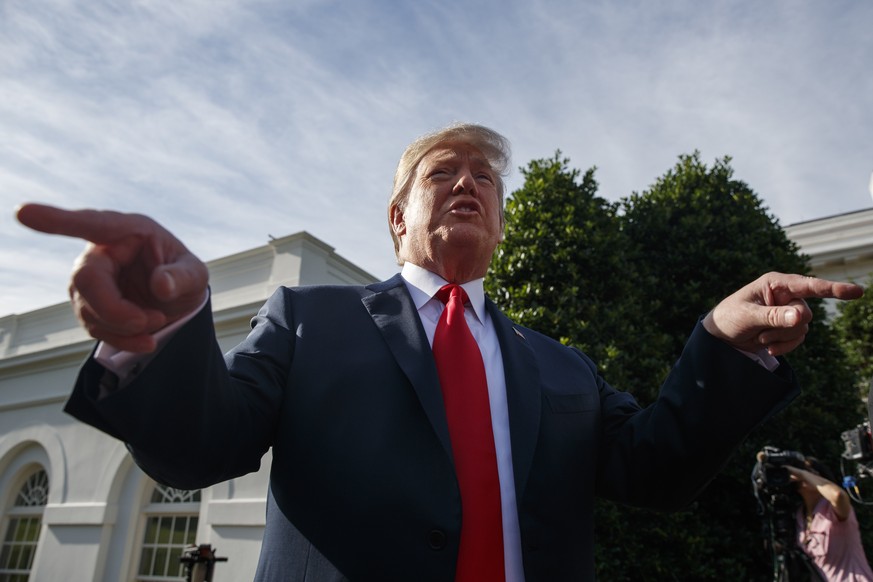 President Donald Trump speaks to reporters on the North Lawn of the White House, Friday, June 15, 2018, in Washington. (AP Photo/Evan Vucci)