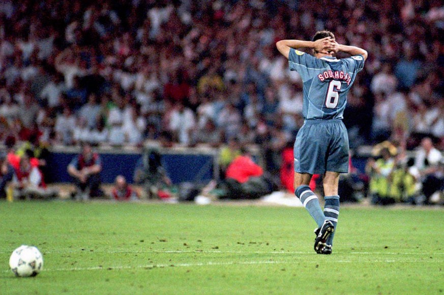 England&#039;s Gareth Southgate walks away holding his head after failing to score in the penalty shootout against Germany which ended England&#039;s chances in the Euro 96 soccer semi-final. Germany  ...