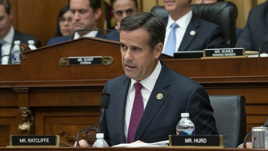 In this Wednesday, July 24, 2019 photo, Rep. John Ratcliffe, R-Texas, a member of the House Intelligence Committee, joined at top right by Chairman Adam Schiff, D-Calif., questions former special coun ...