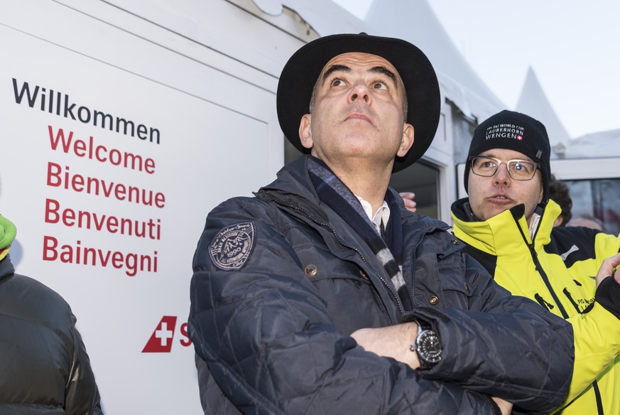 Swiss President Alain Berset, left, talks to Andreas Rickenbacher, former politician and head of marketing of the races, in the finish area ahead of the men&#039;s downhill race at the Alpine Skiing F ...