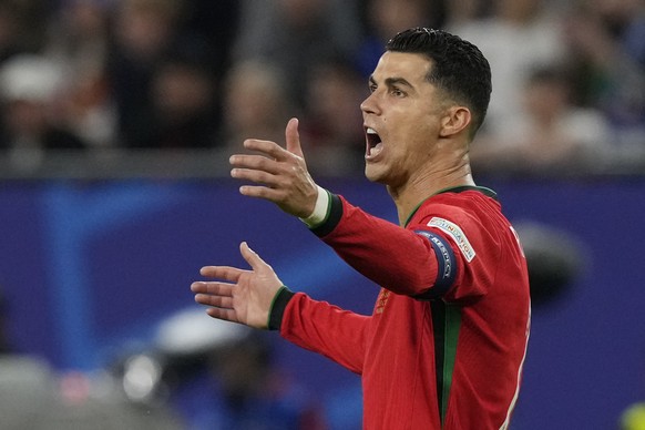 Portugal&#039;s Cristiano Ronaldo reacts after a call during a quarter final match between Portugal and France at the Euro 2024 soccer tournament in Hamburg, Germany, Friday, July 5, 2024. (AP Photo/F ...