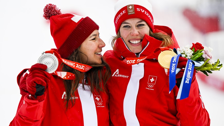 Silver medalist Wendy Holdener of Switzerland, left, and gold medalist Michelle Gisin of Switzerland, right, celebrate during the victory ceremony of the women&#039;s Alpine Skiing Combined slalom rac ...