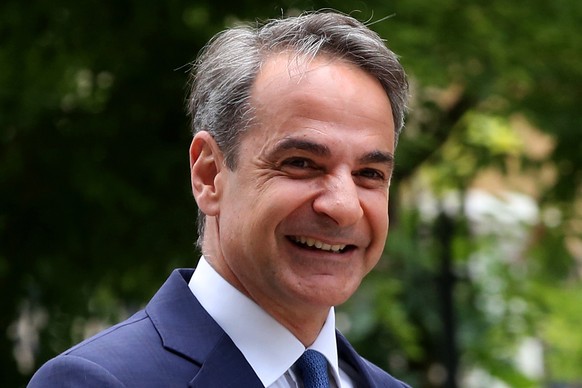 epaselect epa10645748 Greek Prime Minister Kyriakos Mitsotakis enters the Presidential Mansion to formally receive a mandate to form a government from the Greek president (not pictured), in Athens, Gr ...