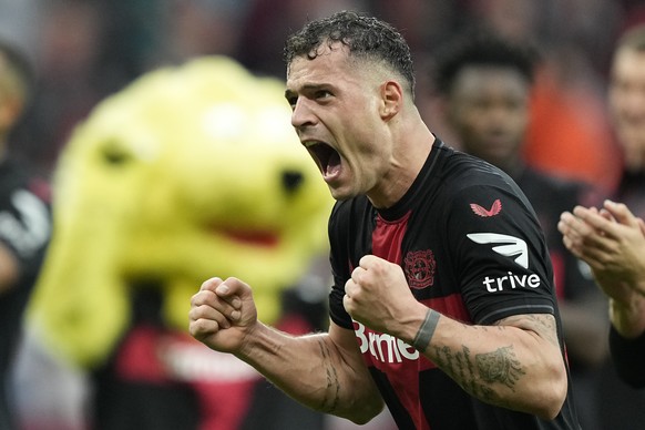 Leverkusen&#039;s Granit Xhaka celebrates after winning the German Bundesliga soccer match between Bayer Leverkusen and TSG Hoffenheim at the BayArena in Leverkusen, Germany, Saturday, March 30, 2024. ...