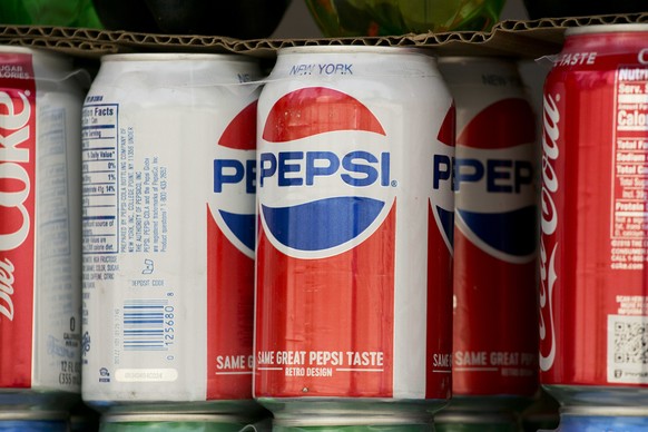 FILE- In this May 7, 2018, file photo, cans of Pepsi are displayed in New York. PepsiCo Inc. reports earns on Tuesday, July 10. (AP Photo/Mark Lennihan, File)