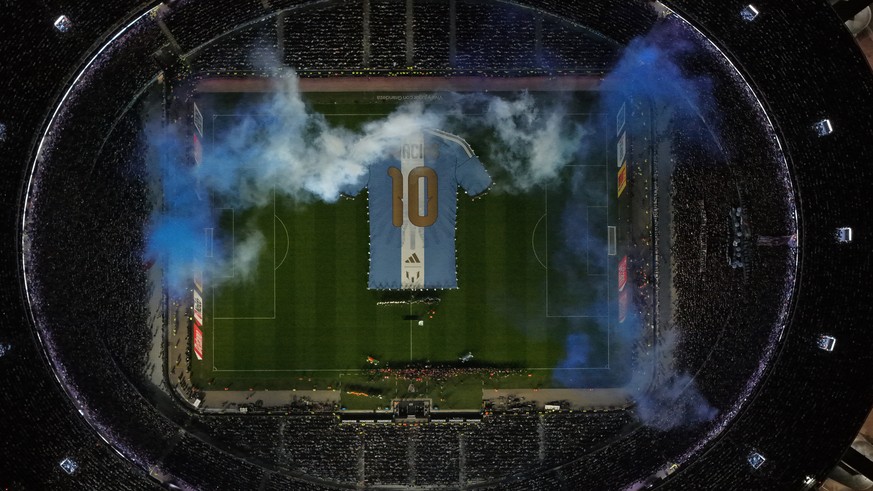 A giant t-shirt with Lionel Messi's number 10 is displayed before an international friendly soccer match against Benin, marking his farewell appearance for the national team, in Buenos Aires, Arg ...