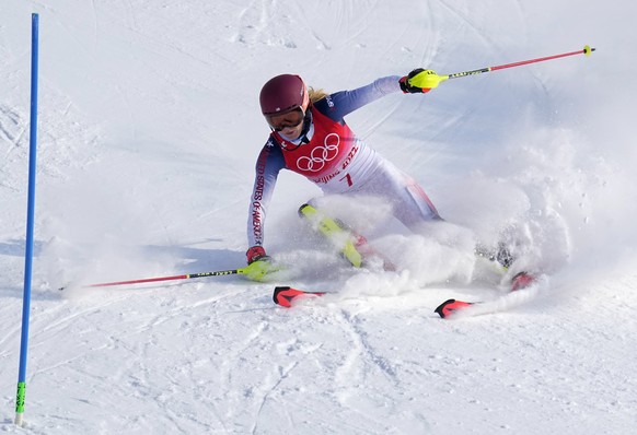 Mikaela Shiffrin, of the United States skis out in the first run of the women's slalom at the 2022 Winter Olympics, Wednesday, Feb. 9, 2022, in the Yanqing district of Beijing. (AP Photo/Robert F ...