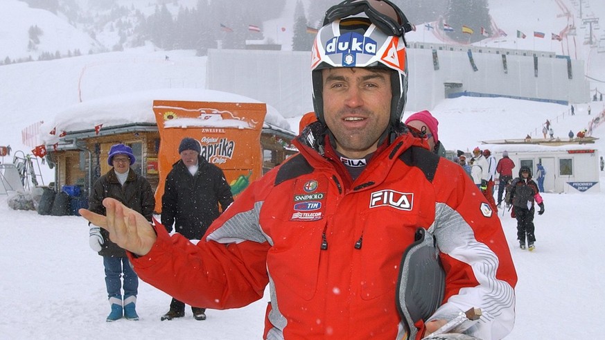 Italian ski racer Kristian Ghedina reacts after the downhill training on the "Silvano Beltrametti" race track was cancelled due to fog and snowfall one day before the Alpine Ski World Cup fi ...