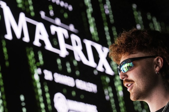Bryce Ryder of Los Angeles awaits a screening of "The Matrix in Shared Reality" on Wednesday, May 28, 2025, at Cosm Los Angeles in Inglewood, Calif. (AP Photo/Chris Pizzello)
Bryce Ryder