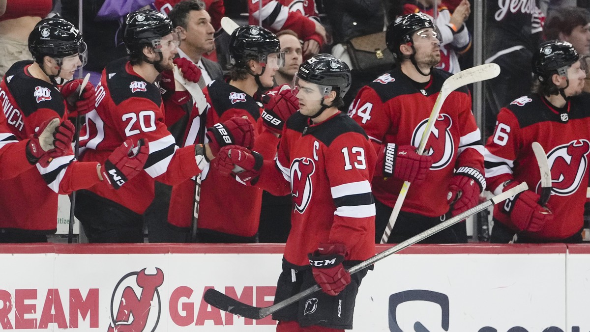 New Jersey Devils' Nico Hischier (13) celebrates with teammates after scoring a goal during the third period of an NHL hockey game against the Los Angeles Kings Thursday, Feb. 23, 2023, in Newark ...